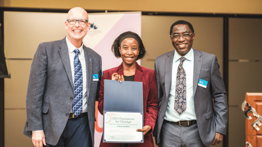 Dr. Tim Rahilly, PhD, President and Vice-Chancellor, Mount Royal University (left) and Dr. Moussa Magassa, PhD, Associate Vice-President, Equity, Diversity and Inclusion (right) present Associate Professor Dr. Jacqueline Musabende, PhD, with a certificate