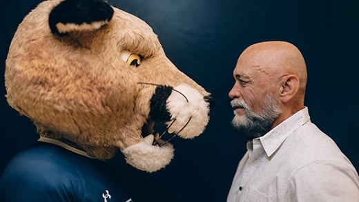 Grant Kelba, right, comes face to face with MRU’s mascot, Calvin the Cougar